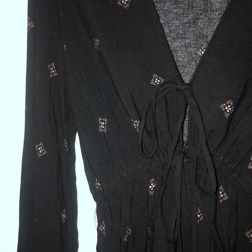 Deep V Neck Black Romper With Pattern on it